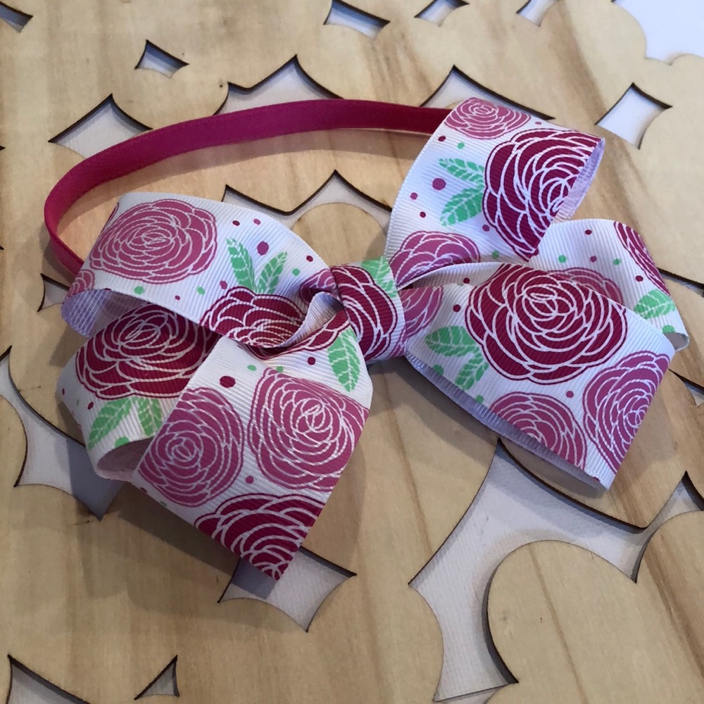 NWT 6 inch floral bow on a pink headband 🎀